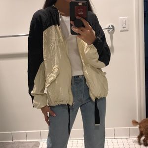 cream black windbreaker